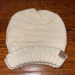 Cream colored C.C beanie. Fits women or girls